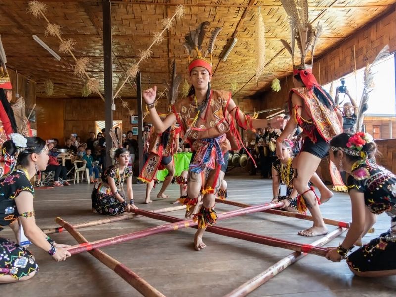 Magunatip bamboo dance Male dancers rhythmically clap bamboo poles together while others jump in and out of the moving poles